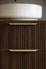 A close-up view of a bathroom vanity with a sink and drawers. Voir les images du produit