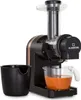 A black and copper juicer is shown against a white background, with a black pulp container and a glass pitcher filled with orange juice. Náhľad obrázku produktu