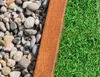 A close-up view of a garden border made of Corten steel, separating gravel and grass. Produktbild-Vorschau