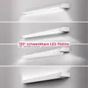 A collage of four images showing a white LED light fixture mounted on a wall from different angles and positions, demonstrating its adjustability. Náhľad obrázku produktu