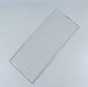 A metal grill rack on a plain gray background. Náhled obrázku produktu