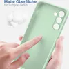 A hand is touching a light green phone case, highlighting its matte texture. Produktbild-Vorschau