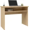 A wooden desk with a laptop, books, and a mug on it. Náhled obrázku produktu
