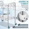A stainless steel laboratory cart with two shelves and wheels, shown in a laboratory setting with overlaid text highlighting assembly features. Produktbild-Vorschau