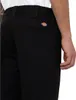 Close-up of the back pocket of black Dickies work pants. Produktbild-Vorschau