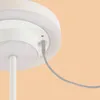 Close-up of the charging port of a white lamp. Produktbild-Vorschau