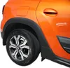 Close-up view of the rear wheel arch and door of an orange car, showing black plastic trim pieces. Náhľad obrázku produktu