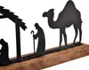 A black metal nativity scene silhouette on a wooden base. Voir les images du produit