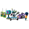 A collection of LEGO Friends toys, including a robot, camera, microphone, and walkie-talkies, arranged on a white background. Produktbild-Vorschau