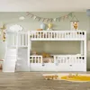 A white bunk bed with a slide and stairs in a child's bedroom. Produktbild-Vorschau