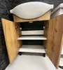 A bathroom cabinet with a sink on top, open doors revealing shelves. Anteprima dell’immagine prodotto