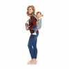 A woman is carrying a child in a baby carrier on her back, holding a thermos in her hand. Náhled obrázku produktu