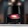 Close-up shot of a black air fryer with a glowing orange and red interior, set against a blurred background. Anteprima dell’immagine prodotto