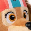 A close-up of a plush toy dog's face, focusing on its eyes and part of its hat. Produktbild-Vorschau