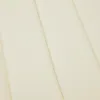 A close-up view of a cream-colored fabric with visible stitching lines. Voir les images du produit