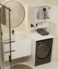 A modern bathroom with a sink, vanity, washing machine, and storage cabinet. Produktbild-Vorschau