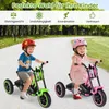 Two children riding tricycles on a paved path outdoors. Produktbild-Vorschau