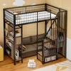 A loft bed with a sofa underneath, bookshelves, and a staircase with storage. The room has a yellow wall with cloud decorations. Náhled obrázku produktu