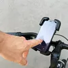 A hand is shown interacting with a smartphone mounted on a bicycle handlebar. Produktbild-Vorschau