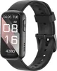 A black smartwatch with a black strap is shown against a white background. The watch face displays the date, time, and step count.