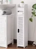 A white bathroom cabinet and a tall, narrow white storage unit with a slatted door and a shelf at the top, containing a small potted plant. Náhled obrázku produktu
