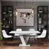 A modern dining room with a white extendable table, chairs, and shelves with decor. Produktbild-Vorschau