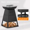 A black outdoor grill with a silver top, filled with firewood at the base. A smaller inset image shows a shelf within the base. Produktbild-Vorschau