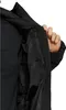 A person's hand is shown reaching into the inner pocket of a black puffer jacket. Produktbild-Vorschau