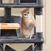 A cat is playing on a multi-level cat tree. Podgląd zdjęcia produktu