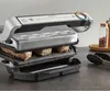A close-up shot of a Tefal Optigrill+ Elektrogrill GC718D10 with steaks cooking on it, placed on a kitchen counter. Voir les images du produit