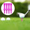 A golf club is about to hit a golf ball on a tee, with other golf balls and tees in the background. Produktbild-Vorschau