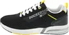 A side view of a black sneaker with white laces and yellow accents. Voir les images du produit