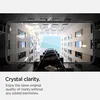 A smartphone screen displaying a view looking up at a modern building with an elevator shaft. Podgląd zdjęcia produktu