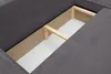 A close-up view of the interior storage compartment of a dark gray corduroy sofa. Produktbild-Vorschau
