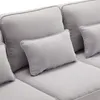 A close-up view of a gray sofa with several cushions. Produktbild-Vorschau