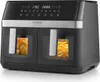 A black and silver dual-chamber air fryer with a digital display and cooking presets. One chamber contains a whole chicken, and the other contains french fries. Produktbild-Vorschau