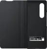 The image shows the inside of a black flip cover case for a smartphone, with the case opened to reveal the interior. Produktbild-Vorschau