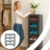A woman is organizing shoes in stackable shoe boxes in a closet. Podgląd zdjęcia produktu