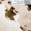 Close-up of intricately cut wood pieces, with German text overlay. Produktbild-Vorschau
