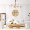 A living room scene with a sofa, coffee table, mirror, and a clock on the wall. Podgląd zdjęcia produktu