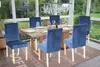 A dining room set with chairs around a wooden table, set in a sunroom with a garden view. Produktbild-Vorschau