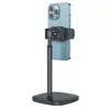 A smartphone is mounted on a black telescopic stand. Produktbild-Vorschau