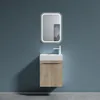 A modern bathroom vanity set with a white sink and a wood-grain cabinet is mounted on a blue wall. Produktbild-Vorschau