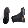 A pair of black lace-up boots with faux fur lining, shown from a top-down perspective against a white background. Voir les images du produit