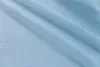 A close-up view of light blue fabric with a linen-like texture. Produktbild-Vorschau