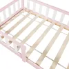 Close-up view of the slatted bed base and pink and white frame of a child's bed. Anteprima dell’immagine prodotto