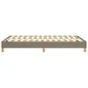 A taupe boxspring bed frame with wooden legs on a white background. Produktbild-Vorschau