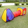 A colorful children's play tent and tunnel set on a grassy lawn. Podgląd zdjęcia produktu