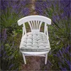A white chair with a striped cushion sits in a field of lavender. Anteprima dell’immagine prodotto