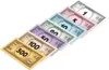 A collection of Monopoly money bills in various denominations, fanned out diagonally against a white background. Produktbild-Vorschau